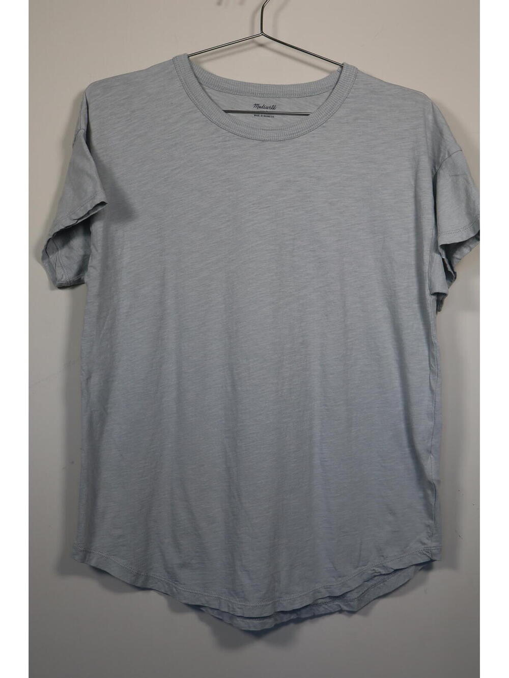 Madewell light blue crewneck t-shirt & curved hemline.